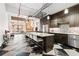 Spacious kitchen with stainless steel appliances, a large island, and a black-and-white checkered floor at 87 Peachtree Sw St # 209, Atlanta, GA 30303