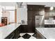 Bright, modern kitchen with white countertops, stainless steel refrigerator, and stylish checkerboard flooring at 87 Peachtree Sw St # 209, Atlanta, GA 30303