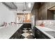 Spacious kitchen showcasing sleek cabinets, stainless steel appliances, and an open design with checkerboard floor at 87 Peachtree Sw St # 209, Atlanta, GA 30303