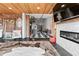 Open-concept living room featuring a fireplace, modern furnishings, and an adjacent kitchen space at 87 Peachtree Sw St # 209, Atlanta, GA 30303