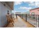 View down rooftop deck, which features seating and access to neighboring building at 87 Peachtree Sw St # 209, Atlanta, GA 30303