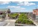 Rooftop garden features planters and AC units overlooking the city on a sunny day at 87 Peachtree Sw St # 209, Atlanta, GA 30303