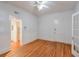 Bright bedroom with hardwood floors, white trim, and a ceiling fan at , Atlanta, GA 30306