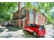 Exterior view of brick apartment building with ample parking space at , Atlanta, GA 30306