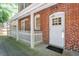 Back of the house with a white door and fence at , Atlanta, GA 30306