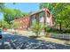 Street view of a brick apartment building with white picket fence at , Atlanta, GA 30306