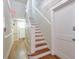 Hallway with hardwood floors, staircase, door and an exit sign at , Atlanta, GA 30306