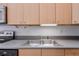 Functional kitchen featuring stainless steel sink, light wood cabinets, and ample counter space at , Atlanta, GA 30306