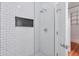 Modern shower with white subway tile, built-in niche, and mosaic tile flooring at , Atlanta, GA 30306