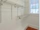 Bright walk-in closet with adjustable wire shelving and a window for natural light at , Atlanta, GA 30306