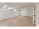 Bright basement featuring new flooring, multiple windows, and a decorative drop ceiling at 145 Devilla Trce, Fayetteville, GA 30214