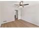 Spacious bedroom featuring modern flooring and a view into the attached bath at 145 Devilla Trce, Fayetteville, GA 30214