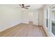 Comfortable bedroom featuring stylish wood floors, fresh paint, and ample natural light at 145 Devilla Trce, Fayetteville, GA 30214