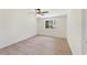 Bright bedroom featuring a ceiling fan and a window that offers natural light at 145 Devilla Trce, Fayetteville, GA 30214