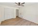 Bedroom features wood-look floors and a spacious closet at 145 Devilla Trce, Fayetteville, GA 30214