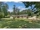 Well-maintained exterior with an expansive green lawn at 145 Devilla Trce, Fayetteville, GA 30214
