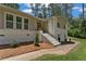 Inviting front entrance with classic white stairs and painted brickwork, framed by tidy landscaping at 145 Devilla Trce, Fayetteville, GA 30214