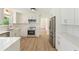 Contemporary kitchen boasting stainless steel appliances, chic white cabinetry, and ample counter space at 145 Devilla Trce, Fayetteville, GA 30214