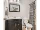 Bathroom featuring modern vanity with a framed mirror, toilet, and patterned shower curtain at 2300 Whiteoak Drive Southeast Se Dr, Smyrna, GA 30080