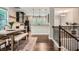 Open dining area with a wooden table and chairs, seamlessly connecting to the kitchen and stairs at 2300 Whiteoak Drive Southeast Se Dr, Smyrna, GA 30080