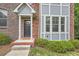 Charming brick home with a covered entryway and well-maintained landscaping at 2300 Whiteoak Drive Southeast Se Dr, Smyrna, GA 30080