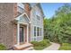 Charming brick home with a covered entryway and well-maintained landscaping at 2300 Whiteoak Drive Southeast Se Dr, Smyrna, GA 30080