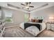 Spacious main bedroom featuring neutral decor, tray ceiling, carpet flooring, and plentiful natural light at 2300 Whiteoak Drive Southeast Se Dr, Smyrna, GA 30080