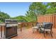 Outdoor deck furnished with a grill and table seating, perfect for outdoor entertaining and relaxation at 2300 Whiteoak Drive Southeast Se Dr, Smyrna, GA 30080