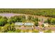 Community amenities featuring tennis courts, pool, clubhouse and parking next to a tranquil lake setting at 2484 Mossy Branch Dr, Snellville, GA 30078