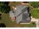 Aerial shot showcases the roof, deck, and landscape at 2484 Mossy Branch Dr, Snellville, GA 30078