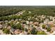 Charming neighborhood with lush trees surrounding beautiful homes, creating a serene environment at 2484 Mossy Branch Dr, Snellville, GA 30078