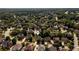 Aerial view of a suburban neighborhood with tree-lined streets and well-maintained homes at 2484 Mossy Branch Dr, Snellville, GA 30078