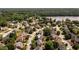 Aerial view of a residential neighborhood surrounded by lush greenery and mature trees at 2484 Mossy Branch Dr, Snellville, GA 30078