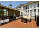 Exterior view of the back deck featuring outdoor furniture and a screened-in porch at 2484 Mossy Branch Dr, Snellville, GA 30078