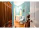 Cozy bathroom featuring a shower with curtain, vanity, toilet, and towel rack at 2484 Mossy Branch Dr, Snellville, GA 30078