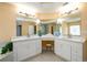 Luxurious main bathroom with dual sink vanity, granite countertops, and ample cabinet space at 2484 Mossy Branch Dr, Snellville, GA 30078