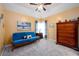 Bedroom featuring a futon with carpeted flooring, neutral paint, ceiling fan and minimal decor at 2484 Mossy Branch Dr, Snellville, GA 30078