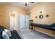 Bedroom featuring a futon with carpeted flooring, neutral paint, ceiling fan and minimal decor at 2484 Mossy Branch Dr, Snellville, GA 30078