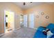 Bedroom featuring a futon with carpeted flooring, neutral paint, ceiling fan and minimal decor at 2484 Mossy Branch Dr, Snellville, GA 30078