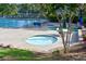 Relaxing community pool with separate hot tub is perfect for socializing with friends and neighbors at 2484 Mossy Branch Dr, Snellville, GA 30078