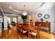 Dining room featuring hardwood floors and decorative trim with views to the living room at 2484 Mossy Branch Dr, Snellville, GA 30078