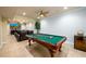 Game room featuring a pool table, tv and a home theater setup at 2484 Mossy Branch Dr, Snellville, GA 30078