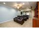 Home theater featuring reclining leather chairs and entertainment center at 2484 Mossy Branch Dr, Snellville, GA 30078