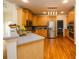 Well-equipped kitchen with stainless steel appliances, maple cabinetry, and a convenient island at 2484 Mossy Branch Dr, Snellville, GA 30078