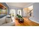 Comfortable living room with hardwood floors, neutral paint, and bright, natural light at 2484 Mossy Branch Dr, Snellville, GA 30078