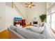 Spacious living room with large windows, fireplace, and comfortable seating at 2484 Mossy Branch Dr, Snellville, GA 30078