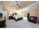 Beautiful main bedroom with carpeted floors and a view to backyard at 2484 Mossy Branch Dr, Snellville, GA 30078