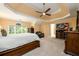 Main bedroom boasts trey ceiling, large windows and private ensuite bathroom at 2484 Mossy Branch Dr, Snellville, GA 30078