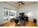 Bright office space with hardwood floors, large windows, and modern desk setup at 2484 Mossy Branch Dr, Snellville, GA 30078