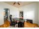 Home office with hardwood floors, closet, and views into the stairway and downstairs bath at 2484 Mossy Branch Dr, Snellville, GA 30078